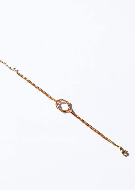 Bracelet en acier inoxydable doré / or, composé d'une chaîne avec un noeud élégant